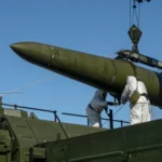 Russian troops load an Iskander missile