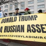 People with a banner saying ''Donald Trump is a Russian asset''